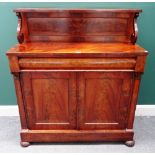 A William IV mahogany chiffonier, with ledge back over cushion drawer and pair of cupboards,