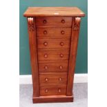 A small Victorian mahogany Wellington chest of seven graduated drawers, enclosed by locking bar,