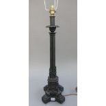 A Victorian style patinated bronze table lamp, cast with four conjoined pillars,