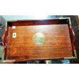 A 20th century Asian style hardwood tray with brass mounted edges and central plaque,