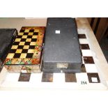 A 20th century marble chess set and board, with further chess pieces.