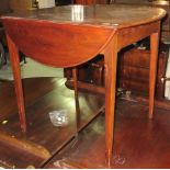 A George III mahogany Pembroke table, on tapering square supports, 61cm wide x 70cm high.