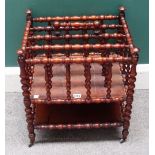 A 19th century French bobbin turned fruitwood four division Canterbury with platform undertier,