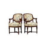 A pair of Louis XVI style open armchairs, circa 1900, with carved mahogany frames and bow seats,