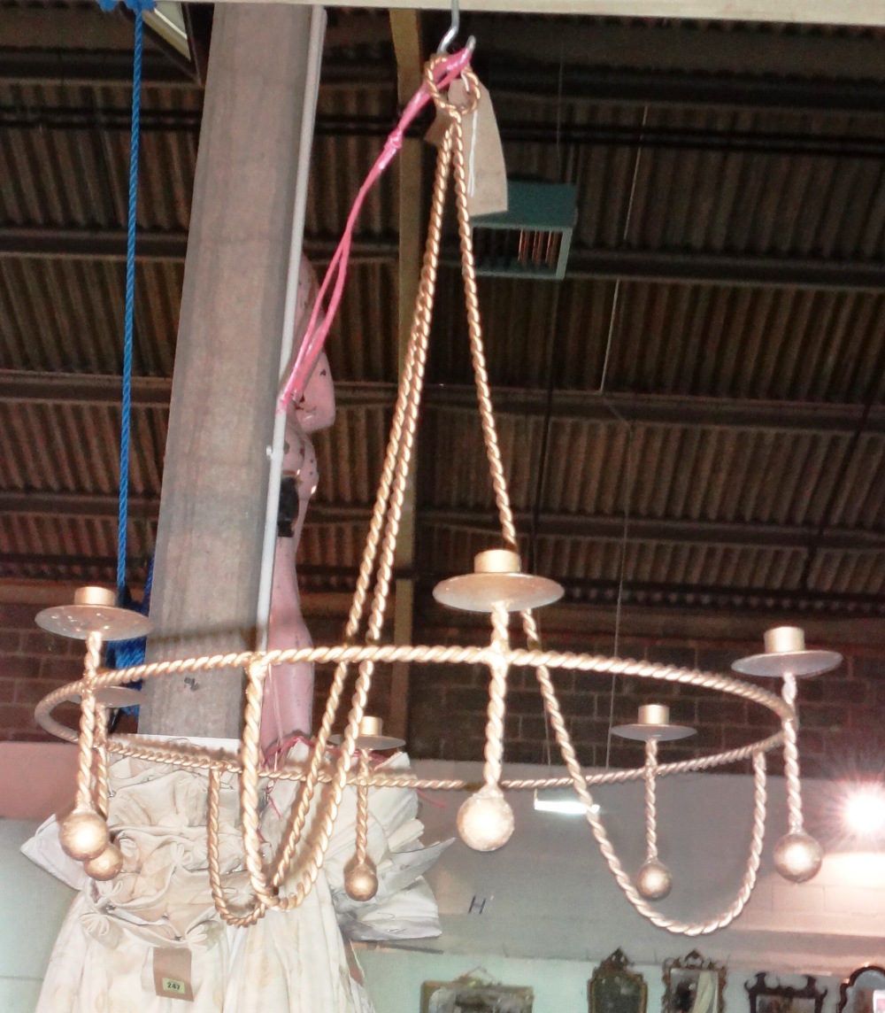 A pair of 20th century gold painted metal rope twist six branch chandeliers, 72cm high, (2).