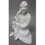 A Chinese blanc-de-chine figure of Li Tieguai, probably early 20th century,