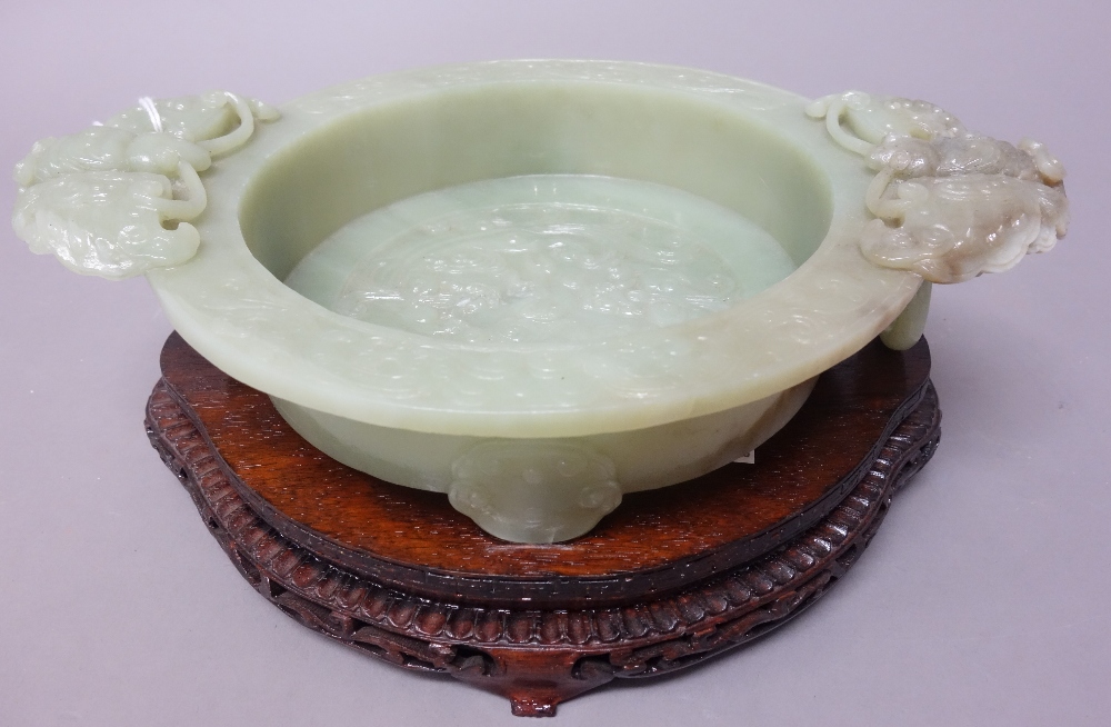 A Chinese green hardstone marriage bowl, 20th century, set with butterfly and ring handles,