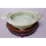 A Chinese green hardstone marriage bowl, 20th century, set with butterfly and ring handles,