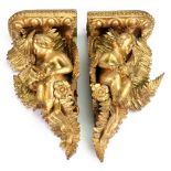 A pair of Victorian carved giltwood and