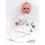 A dressed doll, with composition head, h