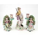 A pair of Derby porcelain figural candle