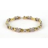 A yellow and white gold and diamond brac