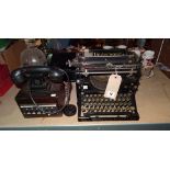 An Underwood typewriter and a switchboard Bakelite phone, (2).