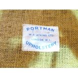 Portman Upholstery; a 20th century low armchair and matching footstool, (2).
