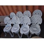 Garden furniture, comprising; a set of eight 20th century white painted cast iron garden chairs,