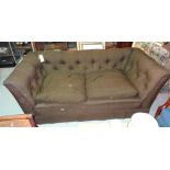 A 20th century brown upholstered button back sofa, 180cm wide.