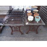 Garden furniture, comprising; a pair of 20th century wrought iron tables with dual end supports,