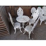 Garden furniture, comprising; a 20th century white painted metal table and a set of four chairs,