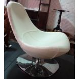 IKEA; a low white leather swivel tub chair on chrome base.