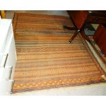 A Turkman flatweave with banded decoration, 202cm x 145cm.