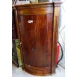 An 18th century style mahogany bow front hanging corner cupboard with single drawer,