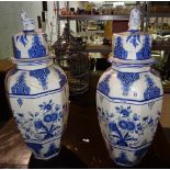 A pair of large 20th century Delft style blue and white vases and covers, 79cm high (2).