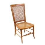 A Victorian style walnut nursing chair, 20th century, with cane panel back and seat,