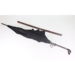 A black umbrella, circa 1900, with bamboo shaft,