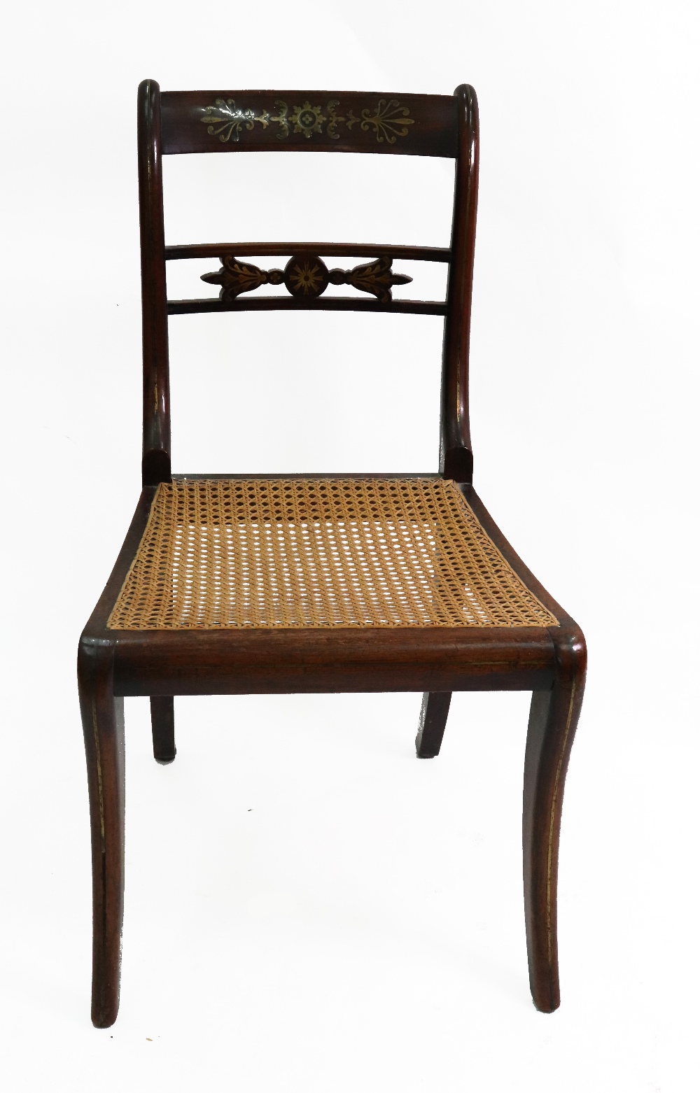 A Regency rosewood cut brass inlaid and strung dining chair, with cane seat.