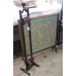 An oak wool winder, 108cm high and a long thread silk work panel,