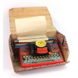 A Mettoy Junior lithographed tinplate typewriter, in original box.