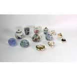 A miniature Coalport porcelain floral painted circular box and cover and a tyg painted with birds,