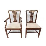 A set of six reproduction Chippendale style mahogany dining chairs,