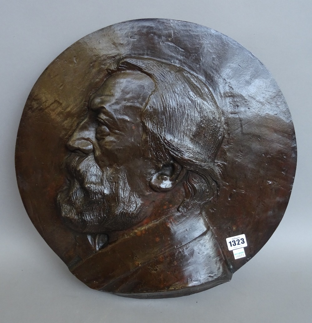 A Belgian bronze circular wall plaque, early 20th century, by Alphonse Joseph Strymans (Belgian,