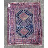 An Afshar rug, the deep blue field with triple rhomboid medallions,