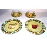 Gucci ceramics, comprising; a pair of 20th century cups and saucers, boxed and two plates boxed,