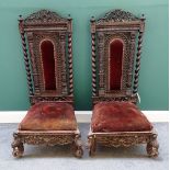 A pair of 19th century Burmese profusely carved hardwood side chairs,