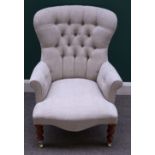 A Victorian style grey upholstered button back armchair on baluster turned supports,