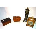 A George III mahogany tea caddy of sarcophagus form 19cm wide x 11cm high,