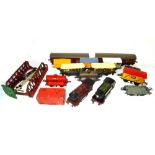 A quantity of 0 gauge locomotives, wagons, track and accessories,