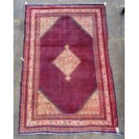 A Saraband carpet, Persian, the indigo boteh filled field with a central diamond,