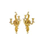 A pair of Rococo Revival giltwood twin candle sconce wall brackets with opposing 'C' scroll back