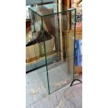 A 20th century toughened glass display pedestal, 30cm wide x 80cm tall.