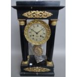 A French ebonised Portico mantel clock, late 19th century, ormolu mounted,