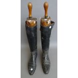 A pair of gentleman's leather riding boots, with fruitwood lasts stamped 'PEAL & Co MAKERS',
