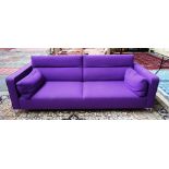 LIGNE ROSET; a 20th century purple upholstered square back sofa, on chrome supports,