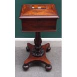 A William IV mahogany teapoy on reeded baluster column and quatrefoil platform,