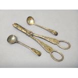 Silver, comprising; a pair of late Victorian grape scissors, having cast decoration, London 1899,