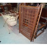 An early 20th century beech framed child's crib and a white painted metal child's crib (2).