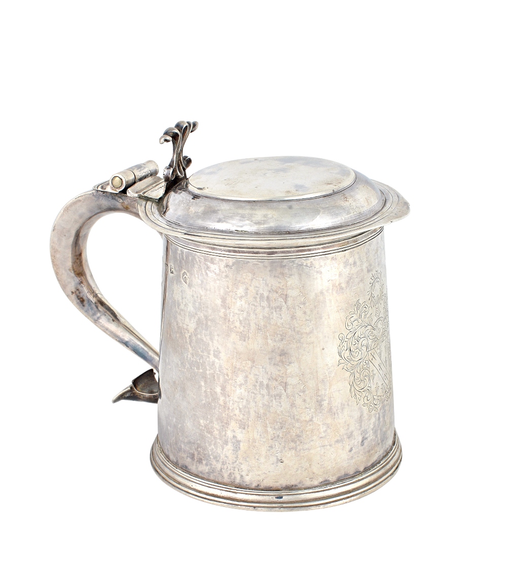 A Charles II silver hinge lidded tankard, of tapering cylindrical form,